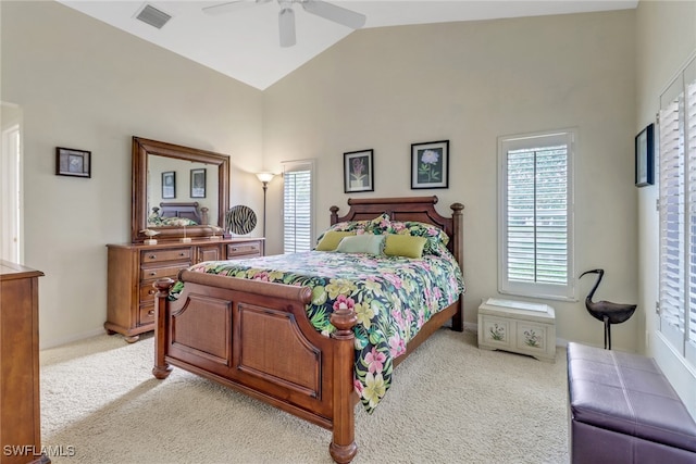 carpeted bedroom featuring ceiling fan and vaulted ceiling