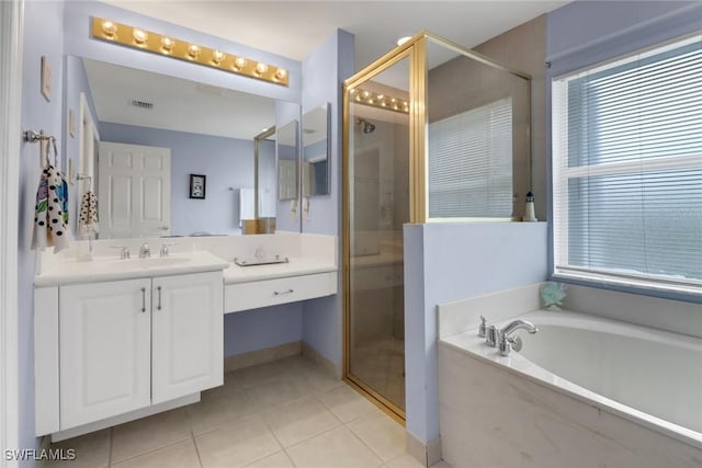 bathroom with plus walk in shower, tile patterned floors, and vanity