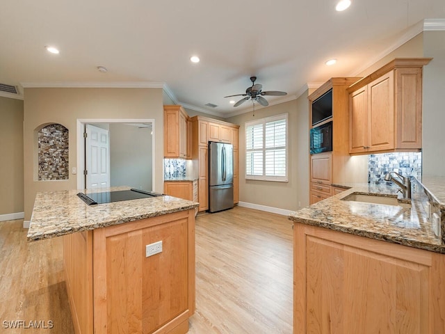 kitchen with ceiling fan, sink, tasteful backsplash, and black appliances