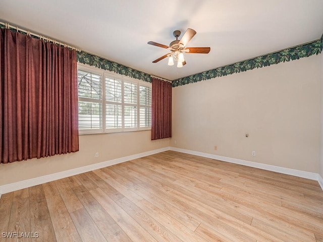 unfurnished room featuring ceiling fan and light hardwood / wood-style flooring