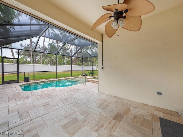 view of swimming pool featuring a lanai, ceiling fan, and a patio area