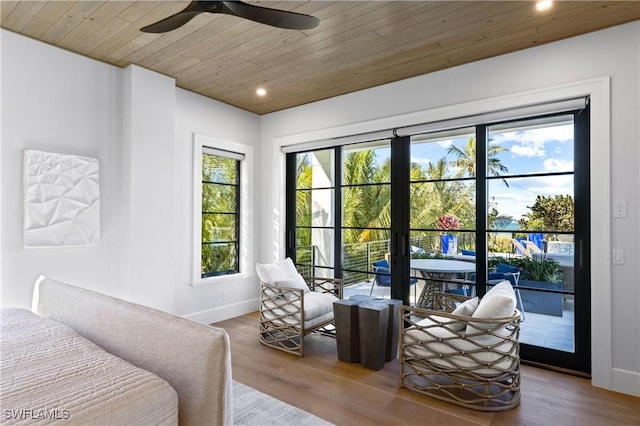 interior space featuring ceiling fan, wooden ceiling, hardwood / wood-style floors, and french doors