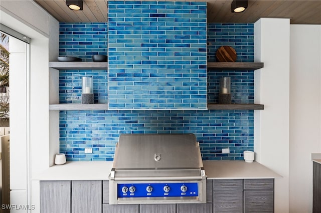 kitchen featuring wooden ceiling and backsplash