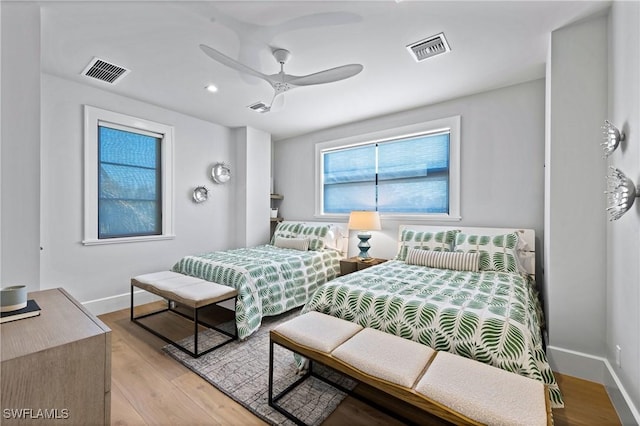 bedroom with ceiling fan and light hardwood / wood-style flooring