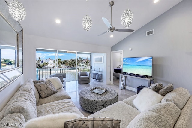 living room with ceiling fan and high vaulted ceiling