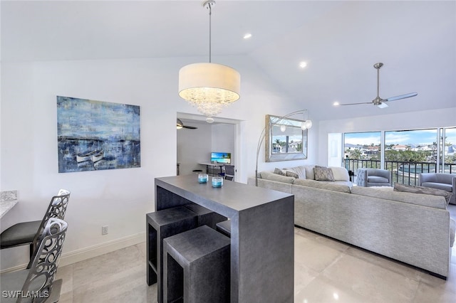 interior space with lofted ceiling and ceiling fan