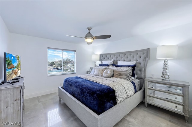 bedroom featuring ceiling fan and concrete flooring