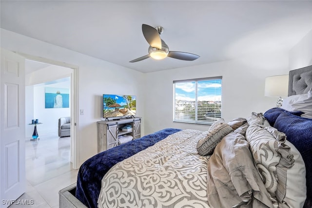 bedroom with ceiling fan and light tile patterned flooring