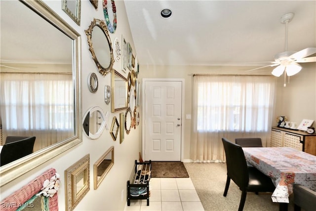 dining room featuring ceiling fan, light tile patterned flooring, and plenty of natural light