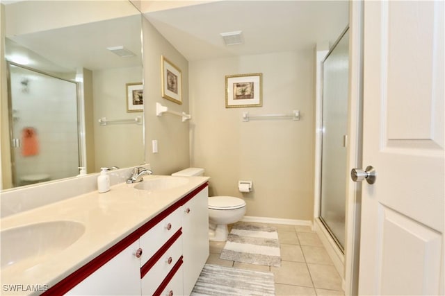 bathroom featuring toilet, tile patterned flooring, an enclosed shower, and vanity