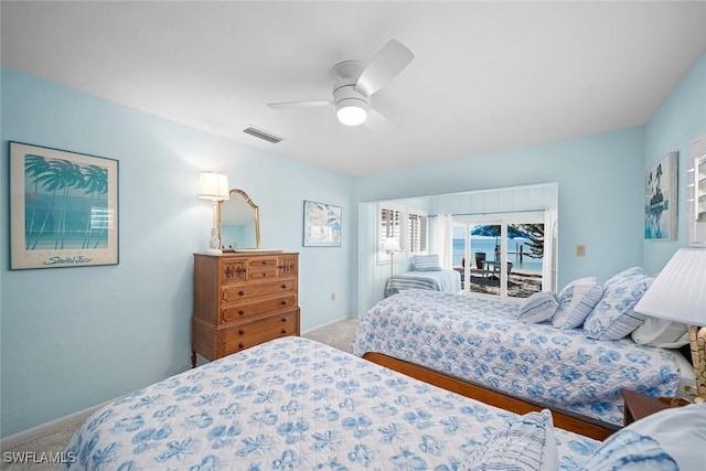 bedroom with carpet floors, access to outside, and ceiling fan