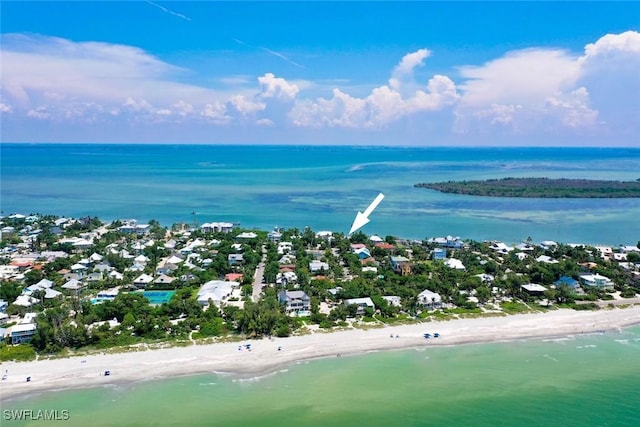 birds eye view of property featuring a water view and a view of the beach