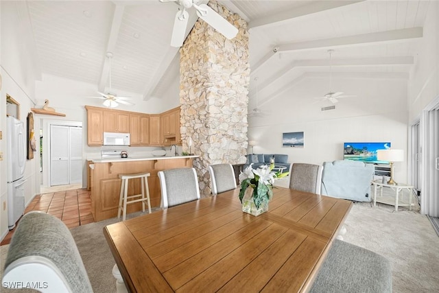 dining area with wood ceiling, ceiling fan, high vaulted ceiling, light colored carpet, and beamed ceiling