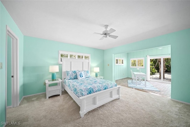 bedroom with light carpet, access to exterior, and ceiling fan