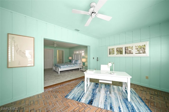 office area featuring ceiling fan and lofted ceiling