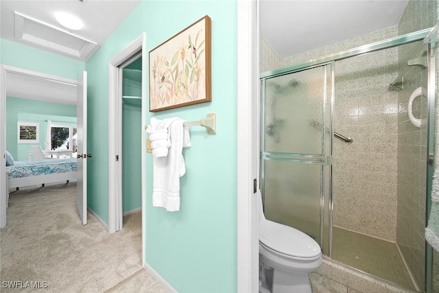 bathroom with toilet and walk in shower