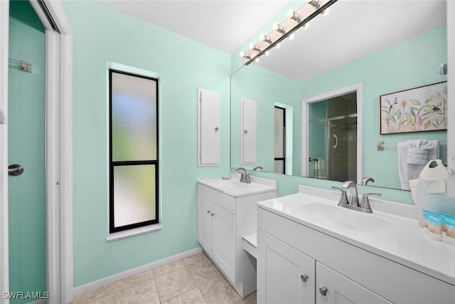 bathroom featuring an enclosed shower, vanity, and tile patterned floors