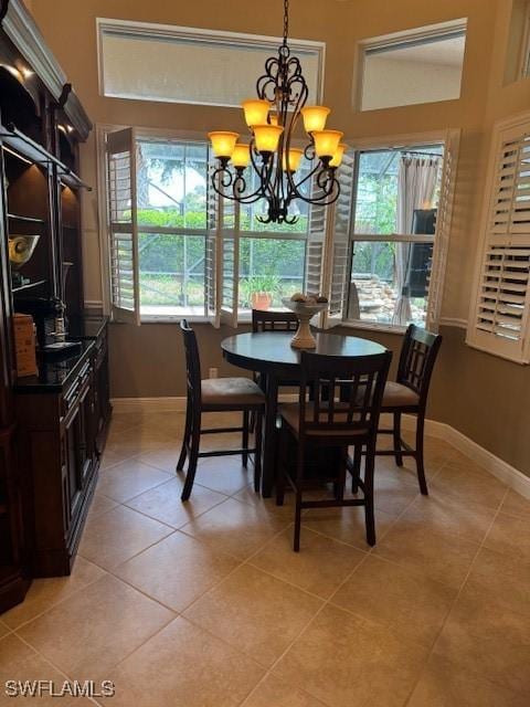 tiled dining area with a notable chandelier