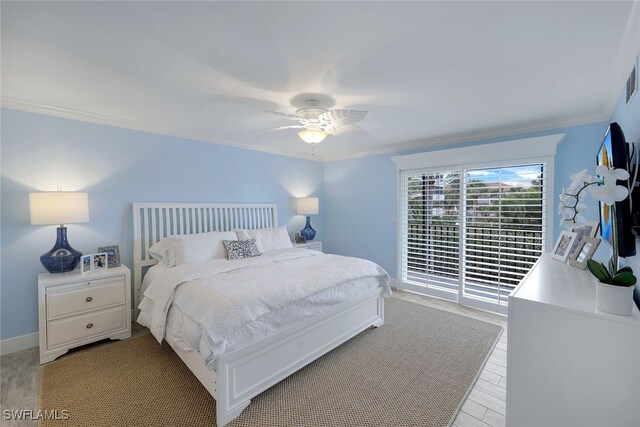 bedroom with ornamental molding and ceiling fan