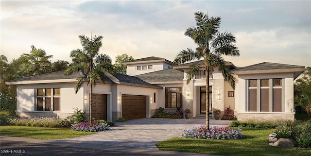 view of front of property with a garage and a lawn