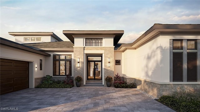 doorway to property featuring a garage