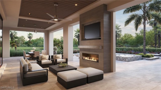 view of patio / terrace with an outdoor living space with a fireplace and ceiling fan