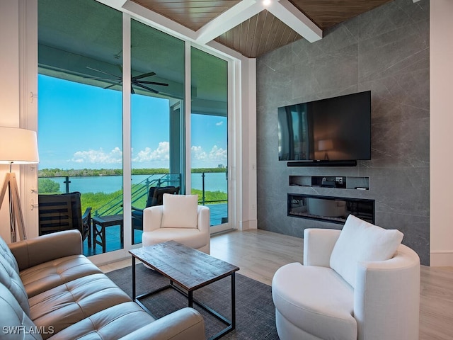 living room with a fireplace, tile walls, and wooden ceiling