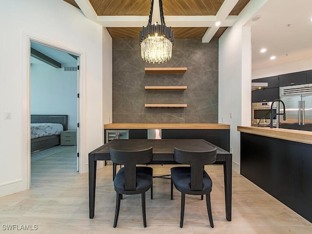 dining space featuring tile walls, wooden ceiling, beamed ceiling, and an inviting chandelier