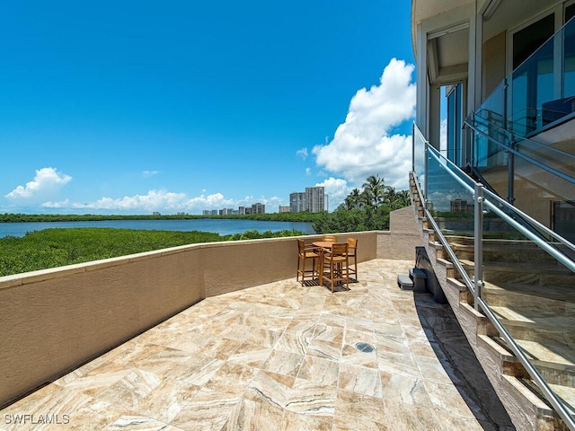 view of patio / terrace with a water view