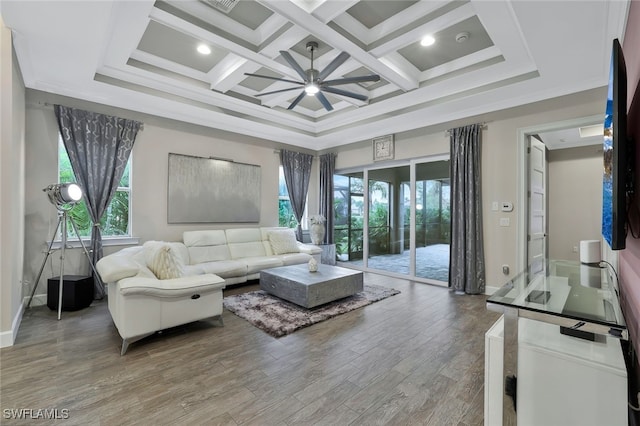 living room with coffered ceiling, ornamental molding, beamed ceiling, ceiling fan, and hardwood / wood-style floors