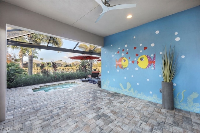 view of swimming pool with ceiling fan and a patio area