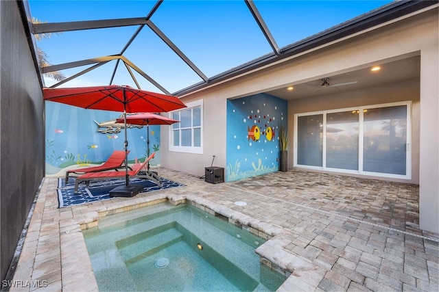 view of swimming pool with a patio and glass enclosure