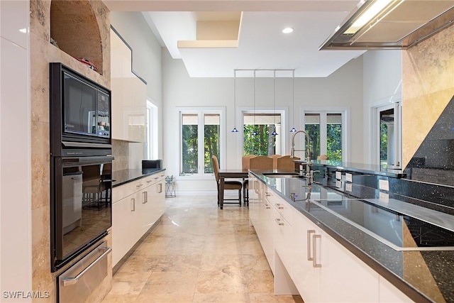 kitchen featuring black appliances, white cabinetry, dark stone counters, sink, and ventilation hood