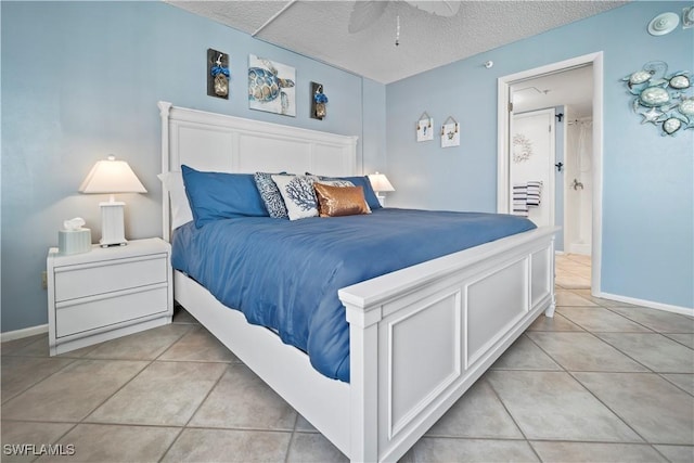 bedroom featuring light tile patterned floors, ceiling fan, a textured ceiling, and baseboards