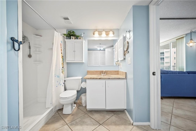 bathroom with vanity, a shower with shower curtain, tile patterned flooring, and toilet