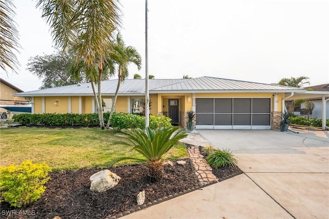 single story home with a garage and a front yard