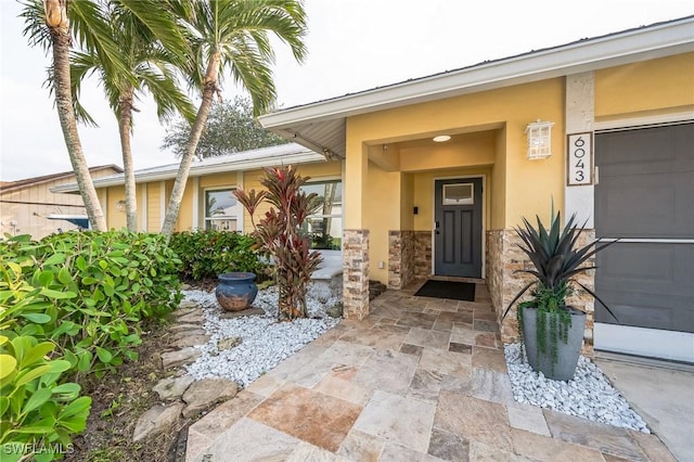 entrance to property featuring a garage