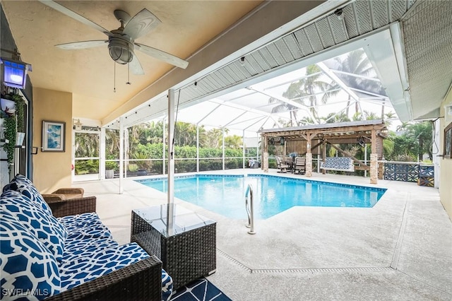 view of pool with a patio area and glass enclosure