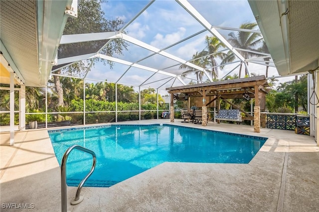 view of pool with a lanai and a patio area