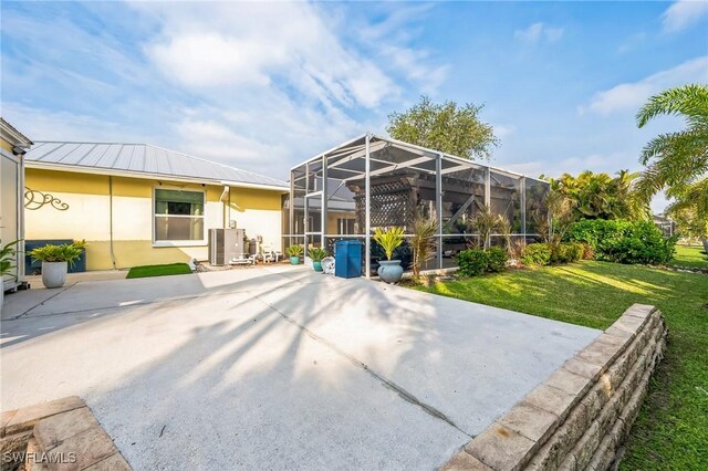 view of patio / terrace with a lanai and cooling unit