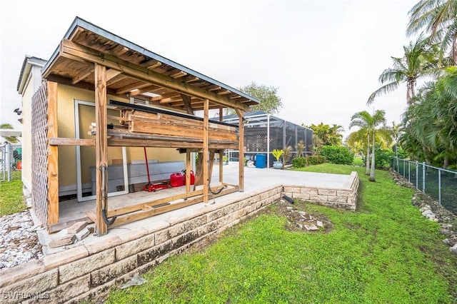 view of yard featuring a lanai and a patio area