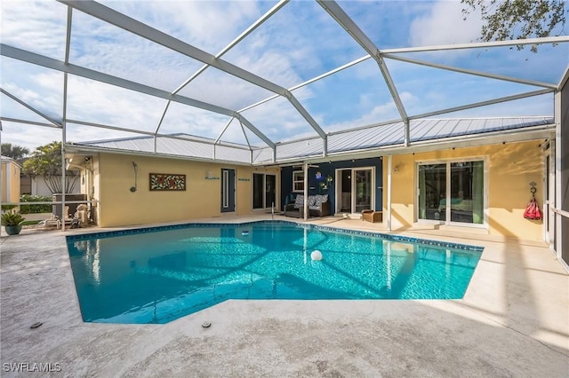 view of pool featuring a patio and glass enclosure