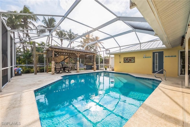 view of swimming pool featuring glass enclosure and a patio area