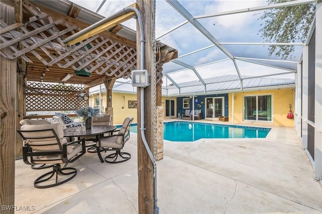 view of swimming pool featuring a lanai and a patio