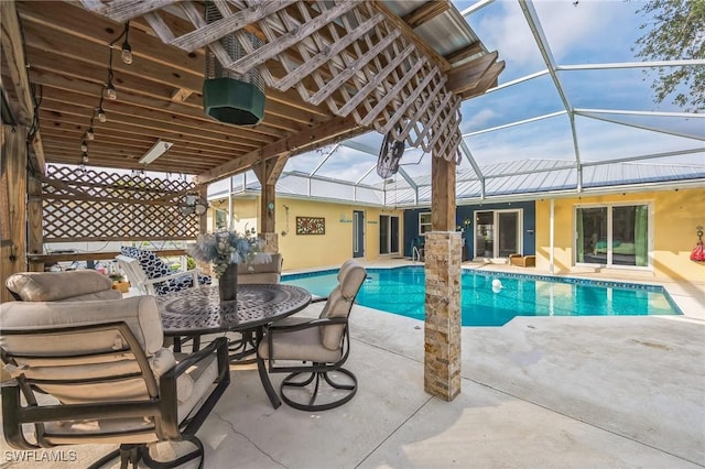 view of pool with a lanai and a patio