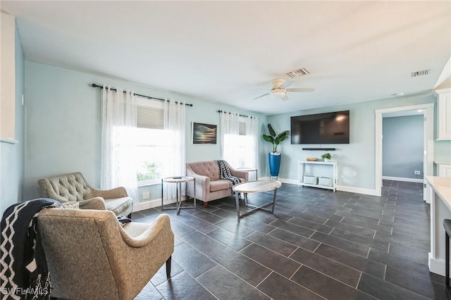 living room featuring ceiling fan