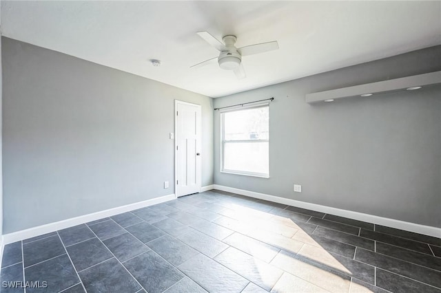 unfurnished room with ceiling fan