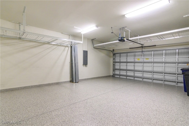 garage featuring a garage door opener and electric panel