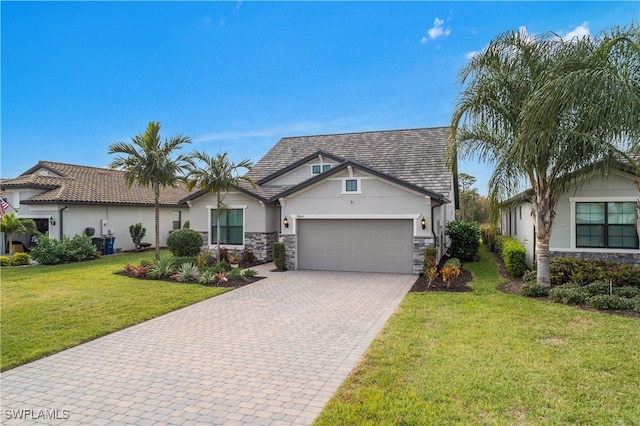 view of front of house featuring a garage and a front yard