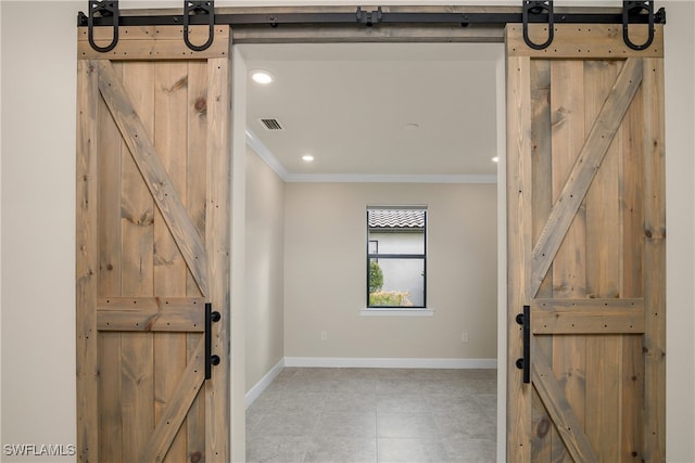 interior space with tile patterned floors and ornamental molding